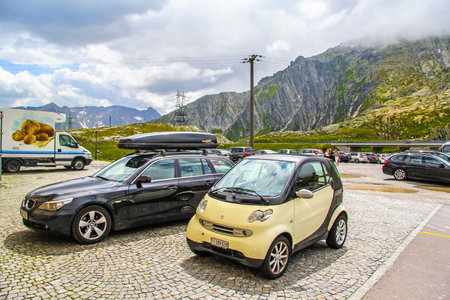 GOTTHARD PASS, SWITZERLAND - AUGUST 5, 2014: Motor car Smart Fortwo at the high Alpine mountain road.のeditorial素材