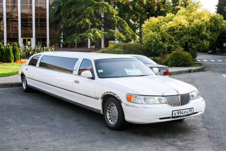 SOCHI, RUSSIA - JULY 19, 2009: White limousine Lincoln Town Car at the city street.のeditorial素材