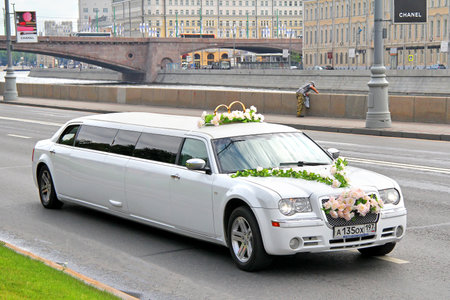 MOSCOW, RUSSIA - JULY 7, 2012: White limousine Chrysler 300C at the city street.のeditorial素材