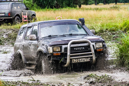 ASHA, RUSSIA - JULY 18, 2015: Off-road vehicle Toyota Surf at the dirt road.のeditorial素材