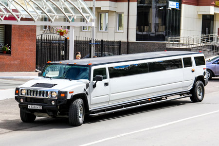 CHEBOKSARY, RUSSIA - JULY 19, 2014: White limousine Hummer H2 at the city street.のeditorial素材