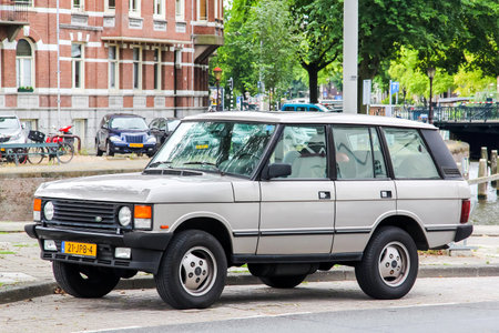 AMSTERDAM, NETHERLANDS - AUGUST 10, 2014: Motor car Range Rover Classic at the city street.のeditorial素材
