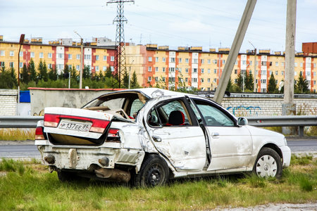 NOVYY URENGOY, RUSSIA - AUGUST 16, 2015: Crashed motor car Nissan Sunny at the city street.のeditorial素材