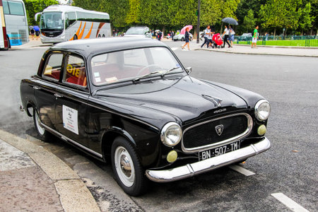 PARIS, FRANCE - AUGUST 8, 2014: Motor car Peugeot 403 at the city street.のeditorial素材