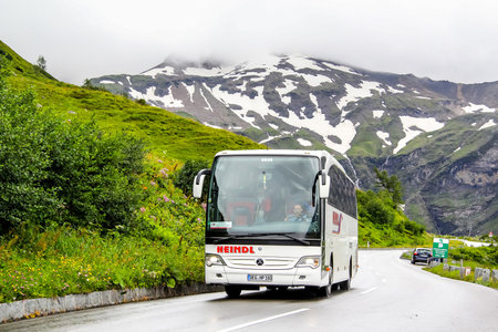 TYROL, AUSTRIA - JULY 29, 2014: Interurban coach Mercedes-Benz O580-15RHD Ttavego at the Grossglockner High Alpine road.のeditorial素材