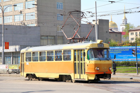 YEKATERINBURG, RUSSIA - MAY 9, 2012: Yellow Tatra T3 tram at city street.のeditorial素材
