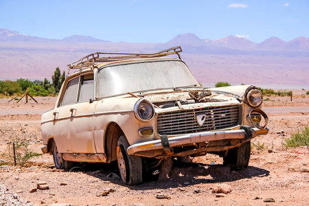 ANTOFAGASTA, CHILE - NOVEMBER 17, 2015: Abandoned car Peugeot 404 at the Atacama desert.のeditorial素材