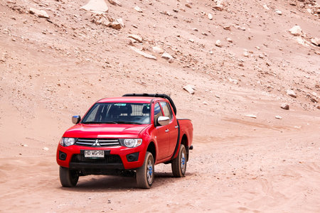 ANTOFAGASTA, CHILE - NOVEMBER 15, 2015: Red pickup truck Mitsubishi L200 at the Atacama desert.のeditorial素材
