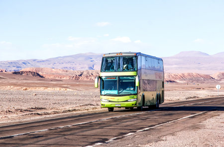 ANTOFAGASTA, CHILE - NOVEMBER 15, 2015: Interurban double-decker coach Marcopolo Paradiso 1800DD at the intercity freeway through the Atacama desert.のeditorial素材