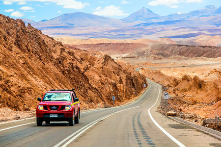 ANTOFAGASTA, CHILE - NOVEMBER 15, 2015: Red pickup truck Nissan Navara at the interurban road.のeditorial素材
