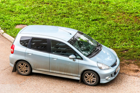 UFA, RUSSIA - SEPTEMBER 23, 2011: Compact motor car Honda Jazz in the city street.のeditorial素材