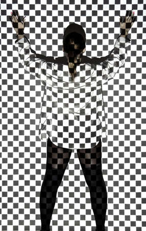 Beautiful young woman covered with black and white squaresの写真素材