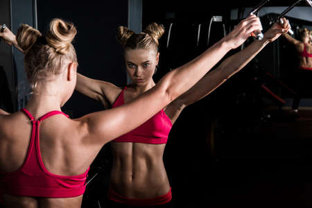 Beautiful young woman in a gymの写真素材