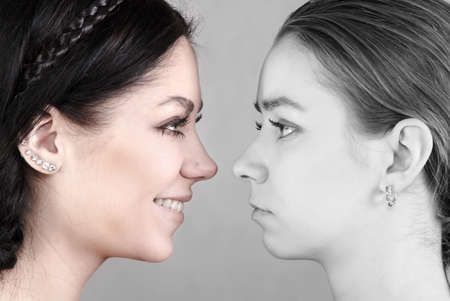 Happy and sad women women's facesの写真素材