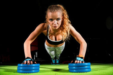 Beautiful young woman in a gym