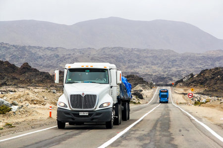 ATACAMA, CHILE - NOVEMBER 18, 2015: Semi-trailer truck International Navistar at the interurban freeway.のeditorial素材