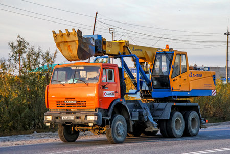 NOVYY URENGOY, RUSSIA - AUGUST 29, 2012: Mobile excavator Kamaz 65111 at the interurban road.のeditorial素材