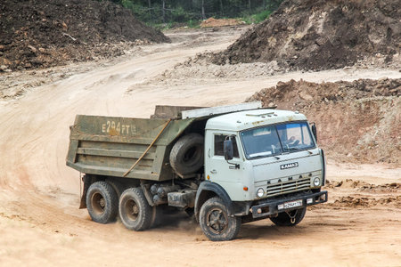TATARSTAN, RUSSIA - MAY 20, 2013: Dump truck KamAZ 55111 in the sand quarry.のeditorial素材