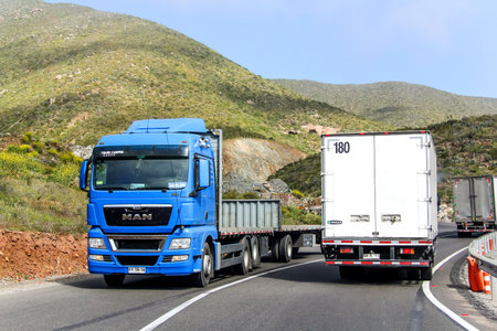 ATACAMA, CHILE - NOVEMBER 13, 2015: Modern blue truck MAN TGX at the mountainous interurban freeway.のeditorial素材