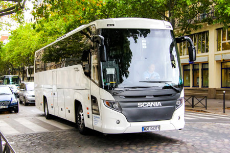 PARIS, FRANCE - AUGUST 8, 2014: Interurban coach Scania Touring (Higer A80T) in the city street.のeditorial素材
