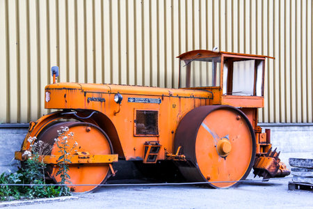 VALAIS, SWITZERLAND - AUGUST 5, 2014: Road roller Hatra 8WD at the countryside.のeditorial素材