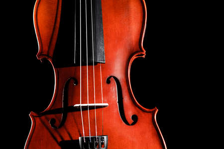 Violin isolated over black background