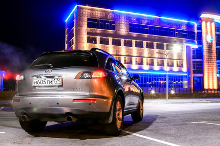 NOVYY URENGOY, RUSSIA - OCTOBER 15, 2016: Grey motor car Infiniti FX35 in the city street.のeditorial素材