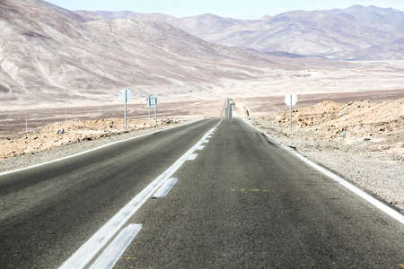 Asphalted road through the Atacama desert (Ruta del Desierto)の写真素材