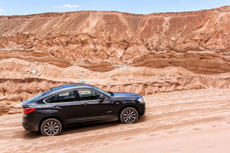 ANTOFAGASTA, CHILE - NOVEMBER 15, 2015: Modern black crossover BMW X4 xDrive 2.8i (F26) in the Valle de la Muerte (Mars Valley) in the Atacama Desert.のeditorial素材
