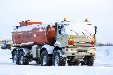 NOVYY URENGOY, RUSSIA - FEBRUARY 14, 2015: Cistern truck KAMAZ 63501 in the snow covered city street.のeditorial素材