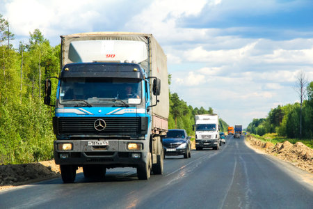 YUGRA, RUSSIA - AUGUST 4, 2012: Flatbed truck Mercedes-Benz SK 2448 at the interurban road.のeditorial素材