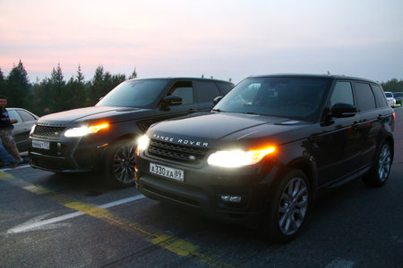 NOVYY URENGOY, RUSSIA - AUGUST 12, 2016: Motor cars Range Rover takes part in the night street drag racing.のeditorial素材