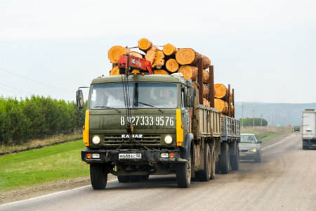 BASHKORTOSTAN, RUSSIA - MAY 8, 2012: Old timber lorry Kamaz 5320 at the interurban road.のeditorial素材