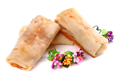 Ground meat filled pancakes isolated over white background