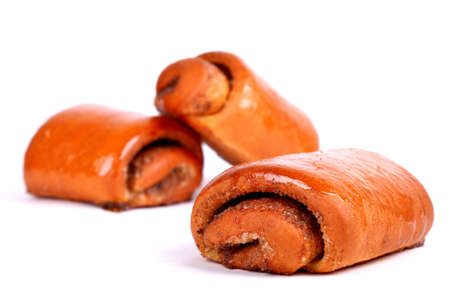 Glazed sweet roulades with poppy seeds isolated over white backgroundの写真素材