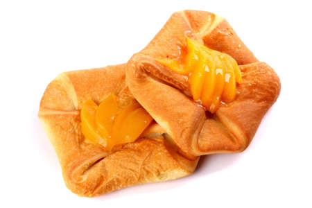 Fresh buns covered with apricots isolated over white backgroundの写真素材