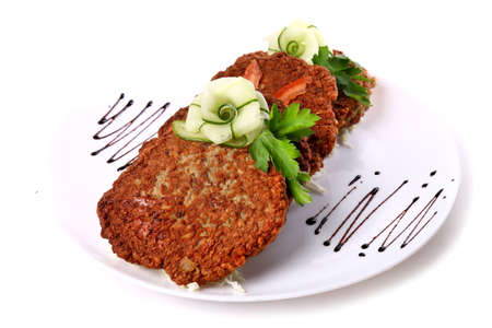 Potato pancakes decorated with cucumber and parsley isolated over white backgroundの写真素材