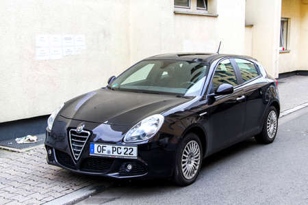FRANKFURT AM MAIN, GERMANY - SEPTEMBER 15, 2013: Motor car Alfa Romeo Giulietta in the city street.のeditorial素材