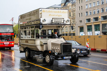BERLIN, GERMANY - AUGUST 16, 2014: Brown handmade sightseeing doubledecker in the city street.のeditorial素材