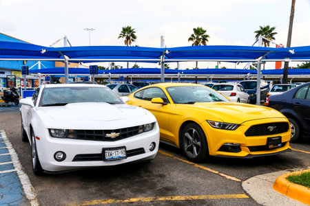 ACAPULCO, MEXICO - MAY 30, 2017: Sports cars Chevrolet Camaro and Ford Mustang in the city street.のeditorial素材