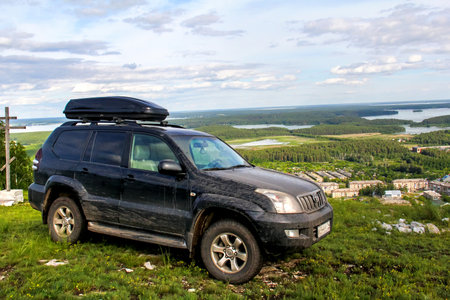 CHELYABINSK REGION, RUSSIA - JULY 8, 2017: Black off-road car Toyota Land Cruiser Prado 120 at the...