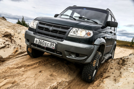 NOVYY URENGOY, RUSSIA - AUGUST 12, 2017: Off-road car UAZ 3163 Patriot at the sandy countryside.のeditorial素材