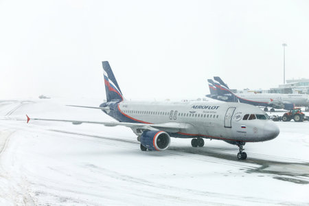 Moscow, Russia - February 3, 2018: Aeroflot Airbus A320 taxiing in the Sheremetyevo International Airport during a heavy snowfall.のeditorial素材