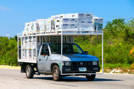 Quintana Roo, Mexico - May 16, 2017: Grey pickup truck Nissan Camiones at the interurban road.のeditorial素材
