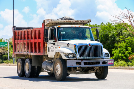 Quintana Roo, Mexico - May 18, 2017: White dump truck International 7400 at the interurban road.のeditorial素材