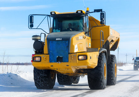 Novyy Urengoy, Russia - April 5, 2014: Yellow articulated dump truck Bell B40D at the interurban...