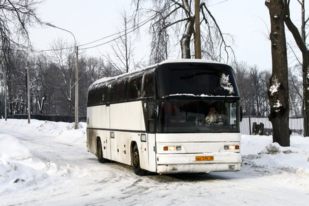 Saint Petersburg, Russia - February 11, 2011: Touristic coach bus Neoplan N116 Cityliner at the countryside.のeditorial素材