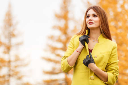Pretty young woman in an autumn forest