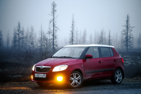 Novyy Urengoy, Russia - May 25, 2016: Red compact hatchback car Skoda Fabia SE at the countryside.のeditorial素材