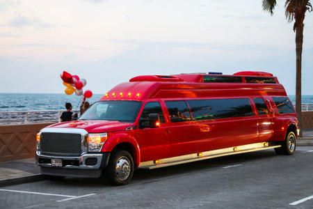 Dubai, UAE - November 17, 2018: Red limousine Ford F-550 Super Duty in the city street.のeditorial素材